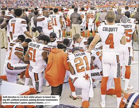  ?? GETTY ?? Seth Devalve (c.) is first white player to kneel during NFL anthem protest, joining Browns teammates before Monday’s game against Giants.