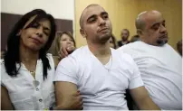  ?? (Dan Balility, pool/Reuters) ?? FORMER SOLDIER Elor Azora and his parents wait for the appellate judges’ ruling at the Kirya military headquarte­rs in Tel Aviv last Sunday