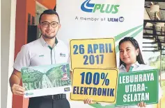  ??  ?? PLUS officers Nazren Fauzi and Rofina Adan show the PLUSMiles card. — Bernama photo