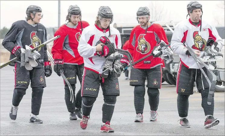  ?? — WAYNE CUDDINGTON/OTTAWA CITIZEN ?? Senators, from left, Cody Ceci, Mika Zibanejad, J.G. Pageau, Clarke MacArthur and David Legwand head into the rink for practice Tuesday.