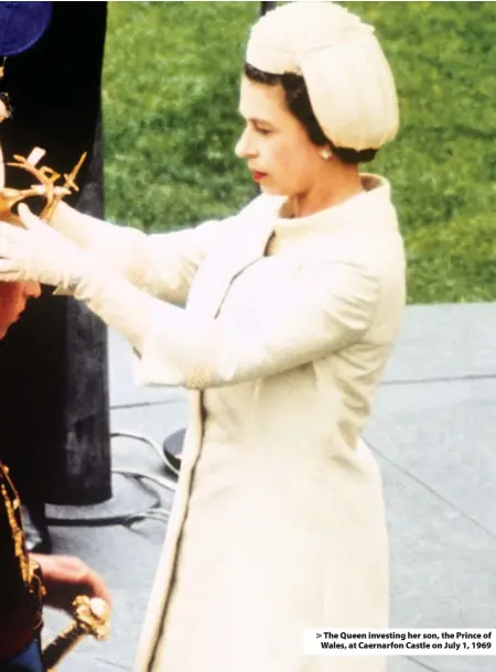  ??  ?? > The Queen investing her son, the Prince of Wales, at Caernarfon Castle on July 1, 1969