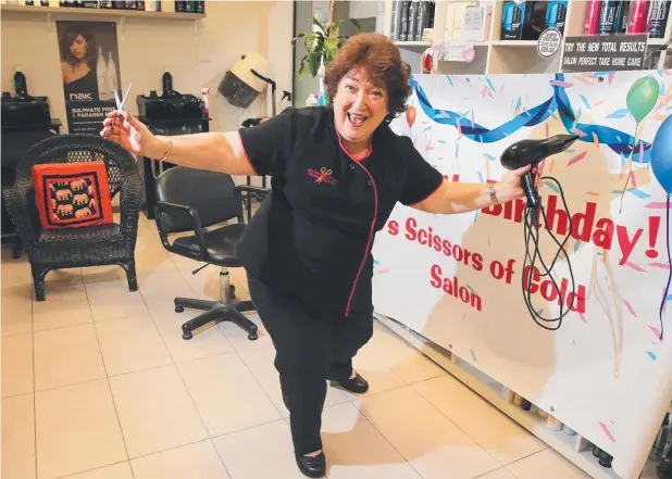  ?? Picture: JUSTIN BRIERTY ?? SHEAR PERFECTION: Jo Lees from Jo's Scissors of Gold is celebratin­g 50 years of business in Oceana Walk between Lake and Grafton streets.