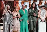  ?? PHOTO BY MATT SAYLES/INVISION/AP ?? Lady Gaga, from left, Jada Pinkett Smith, Alicia Keys, Michelle Obama and Jennifer Lopez speak at the 61st annual Grammy Awards on Sunday in Los Angeles.