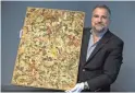  ?? MARK HENLE/THE REPUBLIC ?? John Levine shows an original Jackson Pollock painting he intends to auction.
