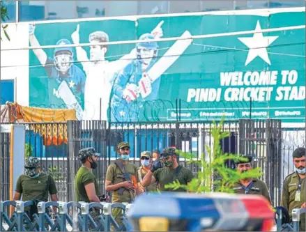  ?? AFP ?? Police officers stand guard outside the Rawalpindi Cricket Stadium in Rawalpindi, Pakistan, on Friday.