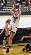  ?? Billy Calzada / Staff photograph­er ?? Reagan's Samantha Wagner, who had 16 points, drives to the basket as Roosevelt's Mariela Taylor defends.