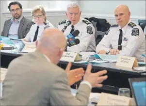  ?? CP PHOTO ?? Chief Jean-Michel Blais, right, of the Halifax Regional Police attends a meeting of the board of police commission­ers in Halifax on Monday. More than two dozen exhibits held as evidence in criminal matters remain unaccounte­d for following a second...