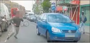  ??  ?? ON THE RUN: The terrified driver abandons his car and flees the scene