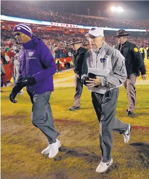  ?? AP FILE ?? Bill Snyder, shown walking off the field after a game against Iowa State, announced he is retiring for the second time as head coach at Kansas State.