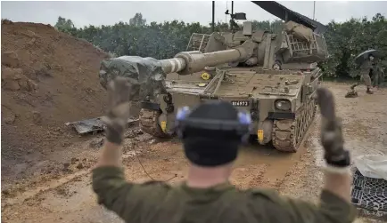  ?? Photo: AP ?? An Israel mobile howitzer gets into position near the border with Lebanon in northern Israel on January 11, 2024.