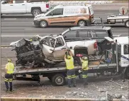  ??  ?? The driver’s pickup truck is cleared from the scene on Monday. Georgia Department of Transporta­tion spokeswoma­n Natalie Dale said the agency is awaiting details of the accident.