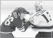  ?? Jim Mone Associated Press ?? THE KINGS’ Kyle Clifford, right, gets into a scrap with the Wild’s Nick Seeler during Thursday’s game.