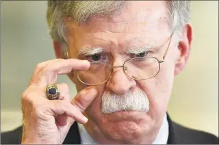  ?? Sergei Gapon / AFP via Getty Images ?? Hawkish former national security adviser John Bolton openly sparred over the administra­tion’s approach to Ukraine.