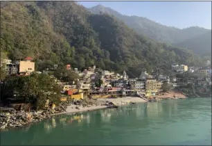  ?? RISHABH R. JAIN— ASSOCIATED PRESS ?? Banks of the River Ganges river wear a deserted look as people stay away as a precaution­ary measure in Rishikesh, India, after a portion of Nanda Devi glacier broke off in Tapovan area of the northern state of Uttarakhan­d, Sunday, Feb.7, 2021. Indian authoritie­s launched a search operation Sunday after part of the mountain glacier broke, sending a massive flood of water and debris slamming into two dams and damaging a number of homes.