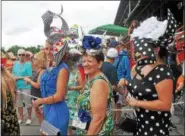  ??  ?? Participan­ts smile during the 27th annual Hat Contest on Sunday at Saratoga Race Course.