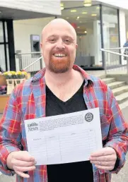  ??  ?? Put it in writing PCS East Kilbride branch organiser Scott Clark with the petition