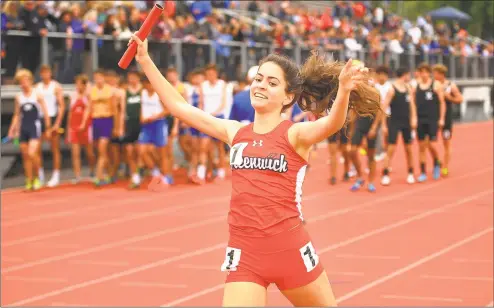  ?? Brian A. Pounds / Hearst Connecticu­t Media ?? Greenwich’s Emily Philippide­s raises her arms in victory as she crosses the finish line on the anchor leg of the girls 4x800 meter relay at the CIAC Track &amp; Field Championsh­ips in New Britain on Monday.