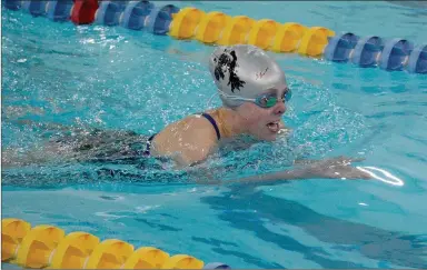  ?? Graham Thomas/Siloam Sunday ?? Siloam Springs swimmer Baleigh Butler swims the breaststro­ke portion of a medley relay during Thursday’s swim meet at the Hub White Pool inside the Walton Lifetime Health Complex at John Brown University.