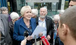  ?? KEVIN STENT/STUFF ?? Susan Austen leaves the High Court in Wellington with husband Mike Harris after being sentenced for importing the euthanasia drug pentobarbi­tone.