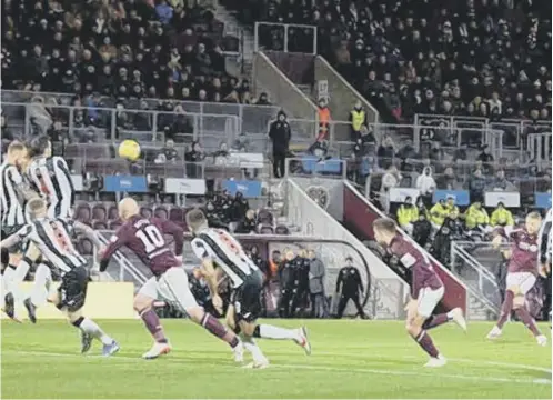  ?? ?? 0 Hearts’ Stephen Kingsley, right, makes it 2-0 against St Mirren with a stunning free-kick