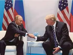  ?? EPA PIC ?? Russian President Vladimir Putin and United States President Donald Trump meeting on the sidelines of the G20 summit in Hamburg, Germany, last month.