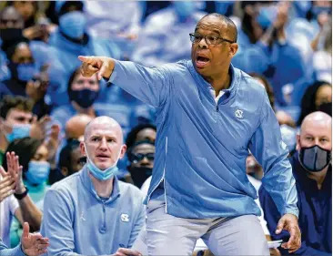  ?? GRANT HALVERSON/GETTY IMAGES/TNS ?? Tar Heels first-year coach Hubert Davis starred at North Carolina from 1988-92 and, after careers in the NBA and with ESPN, served as an assistant to Roy Williams from 2012-21.