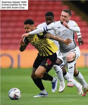  ??  ?? Swansea skipper Matt Grimes battles for the ball with Andre Gray