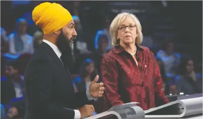  ?? ADRIAN WYLD/POOL/AFP FILES ?? NDP Leader Jagmeet Singh and then-Green Party leader Elizabeth May take part in the federal leaders' French-language debate in 2019.