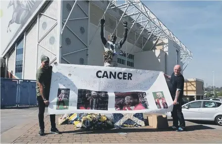  ??  ?? Darren Powell, above left, and Neil Birkenshaw with the banner outside Leeds United’s Elland Road ground and, far left, Bradley Lowery.