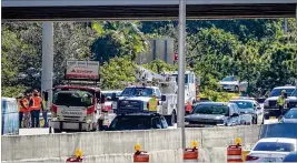  ?? RICHARD GRAULICH / THE PALM BEACH POST ?? Vehicles back up Wednesday on I-95 near the 10th Avenue North overpass. Three northbound lanes on I-95 were closed for more than four hours and eastbound lanes of 10th Avenue North were also closed for some time.