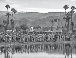  ?? ANDY ABEYTA/THE DESERT SUN ?? The gallery on the 18th green is brought up to the edge of the water during the final round of the 2023 Galleri Classic in Rancho Mirage.