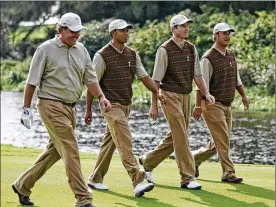  ?? MATTHEW HARRIS/TGPL VIA BLOOMBERG NEWS 2006 ?? Phil Mickelson (from left), Tiger Woods, Jim Furyk and Jim DiMarco walk on the fairway during practice in Ireland before the Ryder Cup in September 2006. Now 48, Mickelson is the oldest player on this year’s U.S. team.