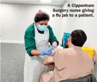  ??  ?? A Cippenham Surgery nurse giving a flu jab to a patient.