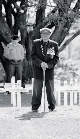  ??  ?? A decorated war veteran pays his respects.