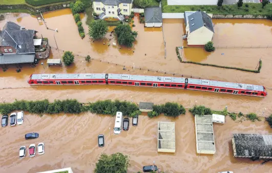  ??  ?? A village is flooded by the high waters of the Kyll river, Rhineland-Palatinate, Kordel, Germany, July 15, 2021. (Photo by Getty Images)