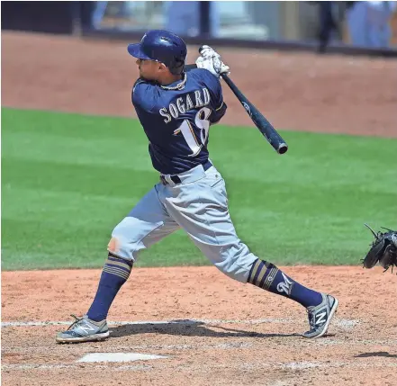  ?? / USA TODAY SPORTS ?? Eric Sogard drives in the tying and go-ahead runs with a double in the seventh inning on Thursday afternoon. Sogard had four hits in the game