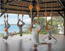  ??  ?? Who knew hanging like a vampire could be such fun? You can try it for yourself at Four Seasons Jimbaran Bay in Bali.