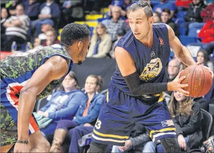  ?? CAPE BRETON HIGHLANDER­S PHOTO ?? St. John’s Edge guard Carl English (right) is shown in action against the Cape Breton Highlander­s in Sydney, N.S., on Tuesday night. English has been the Edge’s main offensive threat early in this NBL Canada season, averaging a team-leading 24 points per game. However, St. John’s head coach Jeff Dunlap felt it was more important to give the 36-year-old Newfoundla­nder a night off rather than to deal with the wear and tear that might come if English suited up when the Edge played their fourth road game in five nights Wednesday in Moncton, N.B.