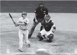  ?? RON JENKINS Getty Images ?? The Dodgers’ Corey Seager slugged a homer in the third inning of Wednesday’s Game 3 of the NLCS against the Braves.