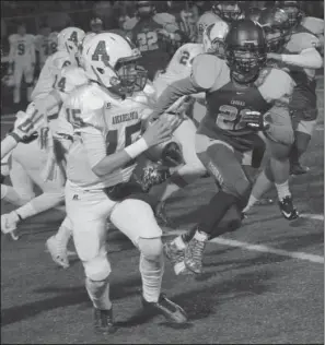  ??  ?? FOUNTAIN RUNS DRY: Arkadelphi­a’s Logan Lucas (15) runs past Fountain Lake’s Dillon Horton (21) during the first half of a Class 4A second-round playoff game Friday night on Allen Tillery Field at Beckham Memorial Stadium. Fountain Lake lost four...