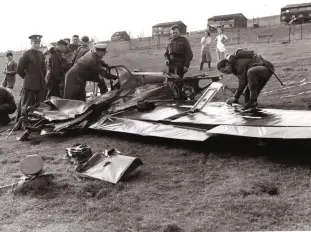  ??  ?? ■ Left: Flying the ‘Jabo’ Messerschm­itt 109 during 1940 could be a hazardous business. This aircraft, W.NR 3734, of Stab I/LG2, took a hit on the 250 kg bomb which detonated and blew the aircraft apart over Elham, Kent. The engine and tail section were found two or three miles distant, with this section of the aircraft compressed to just 18 inches. The pilot, 28-year-old Leutnant Ludwig Lenz, stood no chance.