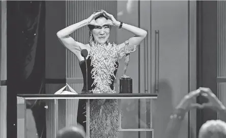  ?? PHOTOS BY KEVIN WINTER/ GETTY IMAGES ?? Michelle Yeoh gestures to her “Everything Everywhere All at Once” co- star Jamie Lee Curtis after winning best actress at the SAG Awards on Sunday.