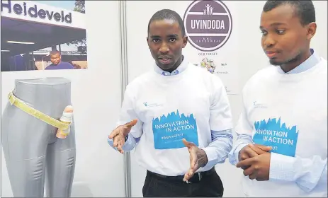  ?? Picture: BHEKI RADEBE ?? CLOSE SUPPORT: Musa Morgan and Lwazi Ntshangase have designed a device they say could be helpful in fighting deaths of initiates after circumcisi­on. Their product was one of 35 student innovation­s showcased at the CPUT Bellville campus.