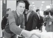  ?? By Robert F. Bukaty, AP ?? Romney: The Republican presidenti­al candidate greets supporters at a caucus on Feb. 11in Portland, Maine.