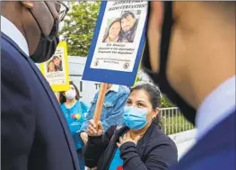  ?? Brian van der Brug Los Angeles Times ?? ROSA PADILLA CERVANTES, mother of shooting victim Isaias Cervantes, talks with attorneys at a news conference on April 22, 2021.