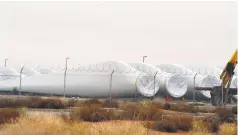  ?? RUSSELL CONTRERAS/AP FILE PHOTO ?? Turbine blades sit in a field in Santa Teresa, a booming but uninhabite­d border area that developers hope to transform.