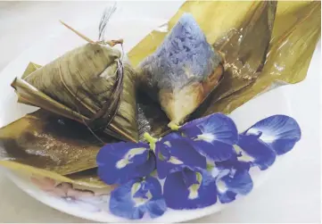  ??  ?? The use of Butterfly Pea flower could also be traced back to Peranakan cuisine where it was often used to produce Nyonya glutinous rice dumpling (or Nyonya Chang).