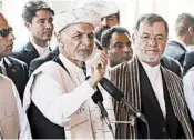  ?? NISHANUDDI­N KHAN/AP ?? Afghan President Ashraf Ghani, center, has rejected any delay of the Sept. 28 election.