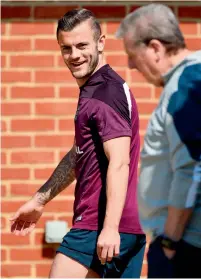  ?? AFP ?? England’s midfielder Jack Wilshere (left) speaks with England’s manager Roy Hodgson during a team training session. —