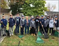  ?? SUBMITTED PHOTO ?? Members of the Junior Comets 2006Team clean up the home of an Oneida County senior citizen.